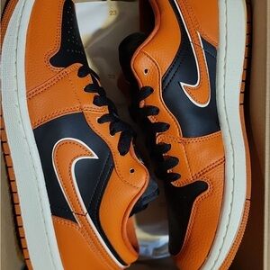 Nike women’s Vibrant Orange and Black Sneakers